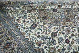 Close-up detail of 2000s Kashan rug from Iran / Persia showing Wool weave