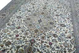 Backside of handmade 2000s Kashan rug showing knot structure and weave density