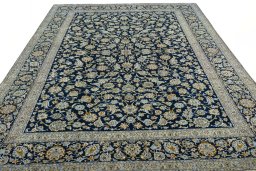 Surface texture of 2000s Kashan rug with natural Wool and intricate pattern