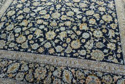 Close-up detail of 2000s Kashan rug from Iran / Persia showing Wool weave