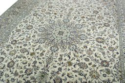 Backside of handmade 2000s Kashan rug showing knot structure and weave density