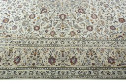 Corner detail of 2000s Kashan rug showing border pattern and Wool pile