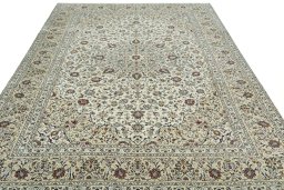 Surface texture of 2000s Kashan rug with natural Wool and intricate pattern