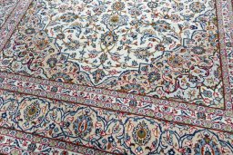 Close-up detail of 2000s Kashan rug from Iran / Persia showing Wool weave