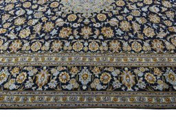 Corner detail of 2000s Kashan rug showing border pattern and Wool pile