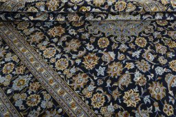 Close-up detail of 2000s Kashan rug from Iran / Persia showing Wool weave