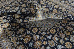 Surface texture of 2000s Kashan rug with natural Wool and intricate pattern