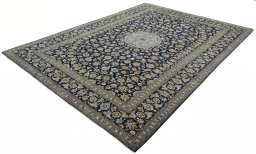 Corner detail of 2000s Kashan rug showing border pattern and Wool pile