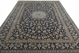 Surface texture of 2000s Kashan rug with natural Wool and intricate pattern