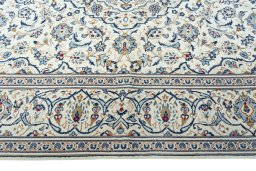 Corner detail of 2000s Kashan rug showing border pattern and Wool pile