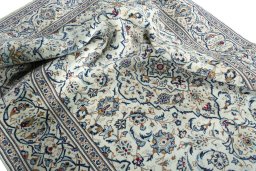 Surface texture of 2000s Kashan rug with natural Wool and intricate pattern