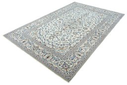 Corner detail of 2000s Kashan rug showing border pattern and Wool pile