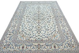 Surface texture of 2000s Kashan rug with natural Wool and intricate pattern