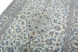 Backside of handmade 2000s Kashan rug showing knot structure and weave density