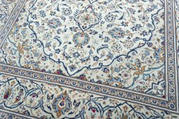 Close-up detail of 2000s Kashan rug from Iran / Persia showing Wool weave