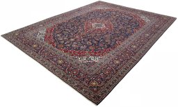 Corner detail of 2000s Kashan rug showing border pattern and Wool pile