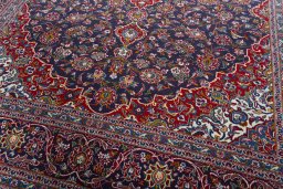 Close-up detail of 2000s Kashan rug from Iran / Persia showing Wool weave