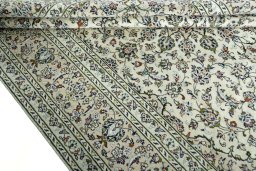 Close-up detail of 2000s Kashan rug from Iran / Persia showing Wool weave