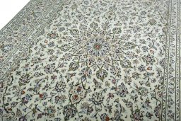 Backside of handmade 2000s Kashan rug showing knot structure and weave density