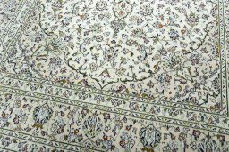 Close-up detail of 2000s Kashan rug from Iran / Persia showing Wool weave
