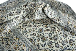 Surface texture of 2000s Kashan rug with natural Wool and intricate pattern