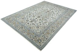 Corner detail of 2000s Kashan rug showing border pattern and Wool pile