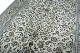 Backside of handmade 2000s Kashan rug showing knot structure and weave density