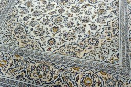 Close-up detail of 2000s Kashan rug from Iran / Persia showing Wool weave