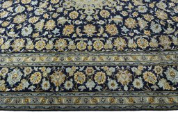 Corner detail of 1970s Kashan rug showing border pattern and Wool pile