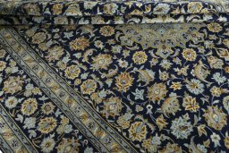 Close-up detail of 1970s Kashan rug from Iran / Persia showing Wool weave