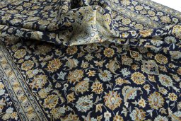 Surface texture of 1970s Kashan rug with natural Wool and intricate pattern