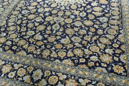 Close-up detail of 1970s Kashan rug from Iran / Persia showing Wool weave