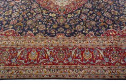 Corner detail of 2000s Kashan rug showing border pattern and Cork pile