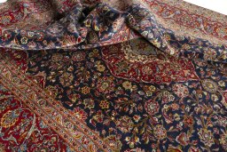 Surface texture of 2000s Kashan rug with natural Cork and intricate pattern