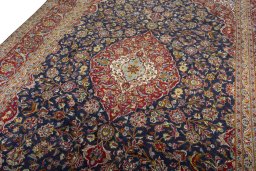 Backside of handmade 2000s Kashan rug showing knot structure and weave density
