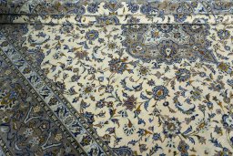 Close-up detail of 2000s Kashan rug from Iran / Persia showing Wool weave