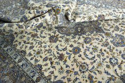 Surface texture of 2000s Kashan rug with natural Wool and intricate pattern