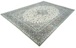 Corner detail of 2000s Kashan rug showing border pattern and Wool pile