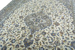 Backside of handmade 2000s Kashan rug showing knot structure and weave density