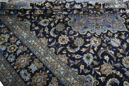 Close-up detail of 2000s Kashan rug from Iran / Persia showing Wool weave
