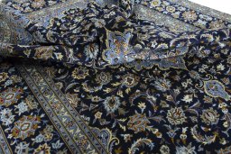 Surface texture of 2000s Kashan rug with natural Wool and intricate pattern