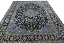 Surface texture of 2000s Kashan rug with natural Wool and intricate pattern