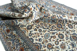 Surface texture of 2000s Kashan rug with natural Wool and intricate pattern