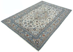 Corner detail of 2000s Kashan rug showing border pattern and Wool pile