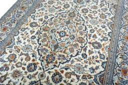 Backside of handmade 2000s Kashan rug showing knot structure and weave density