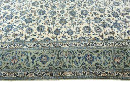 Corner detail of 2000s Kashan rug showing border pattern and Wool pile