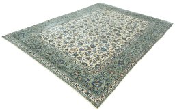 Corner detail of 2000s Kashan rug showing border pattern and Wool pile