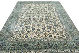 Surface texture of 2000s Kashan rug with natural Wool and intricate pattern