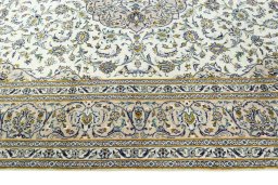 Corner detail of 2000s Kashan rug showing border pattern and Wool pile