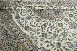 Close-up detail of 2000s Kashan rug from Iran / Persia showing Wool weave